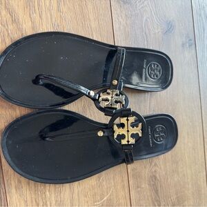 Tory Burch Black Flip Flops with Gold Emblem